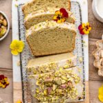Sliced vegan pistachio loaf cake.